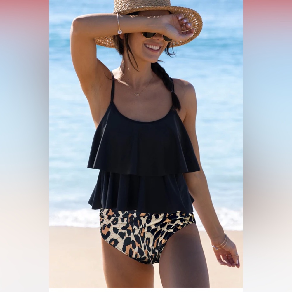 New with tags tankini swimsuit. Hish waist bottoms. Size XL.  Smoke free home.